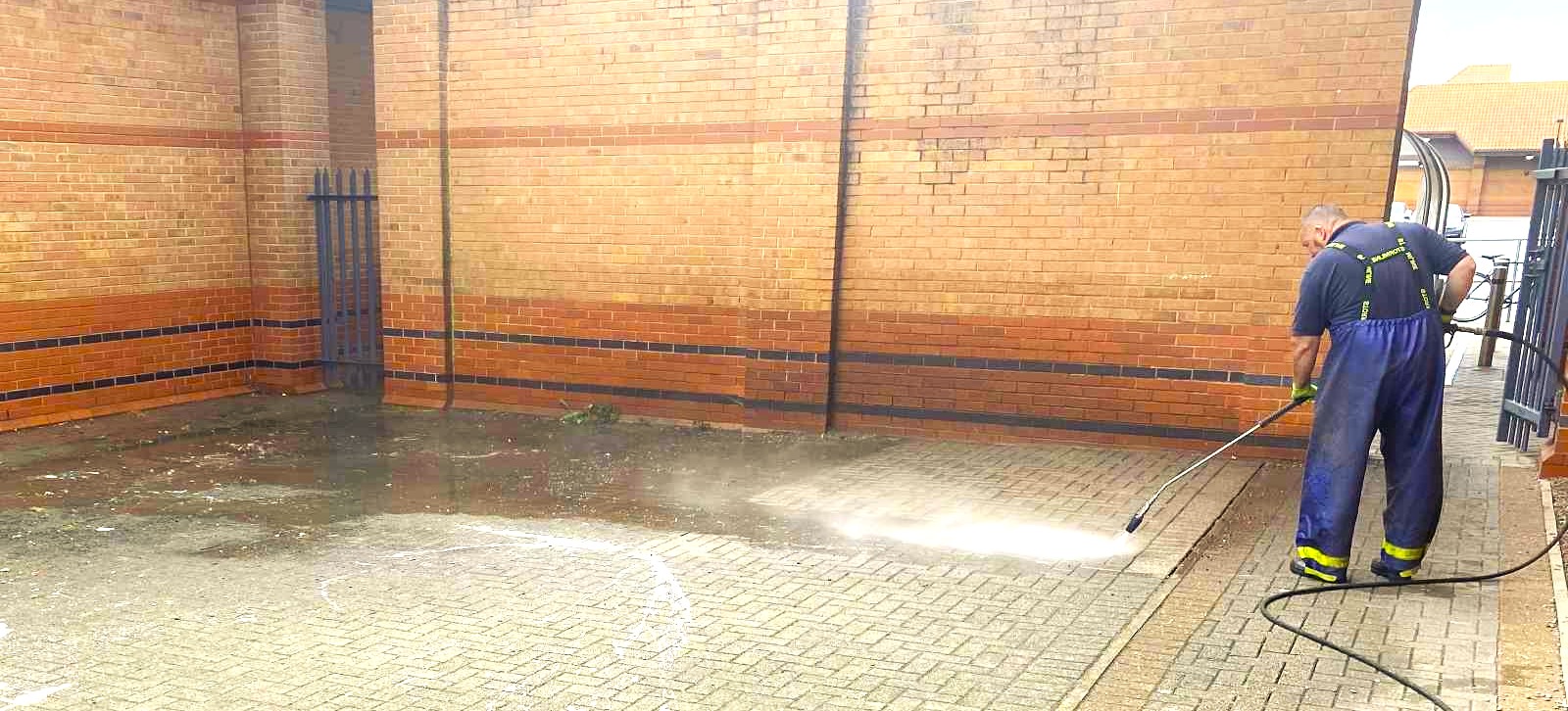 Pressure washing block paving leaving a clean line