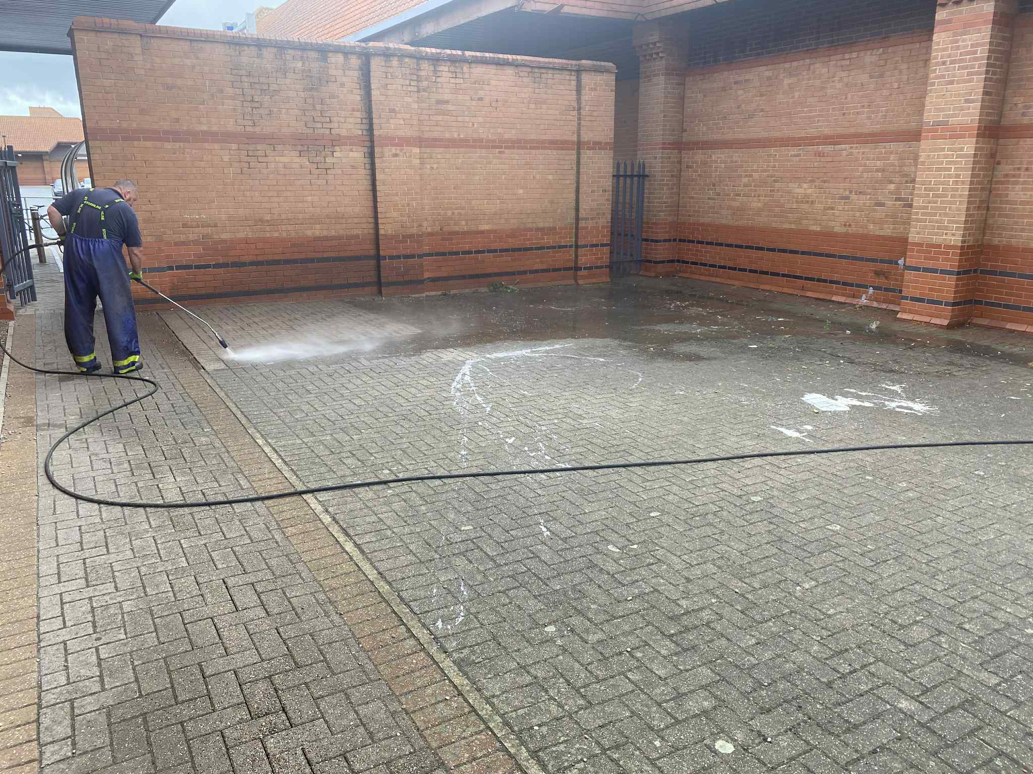 MMC pressure washing a paved courtyard in Teesside