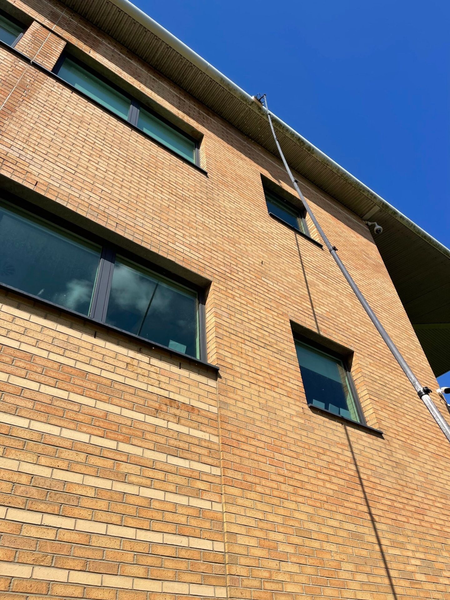 Commercial building exterior cleaning by MMC Exterior Cleaning