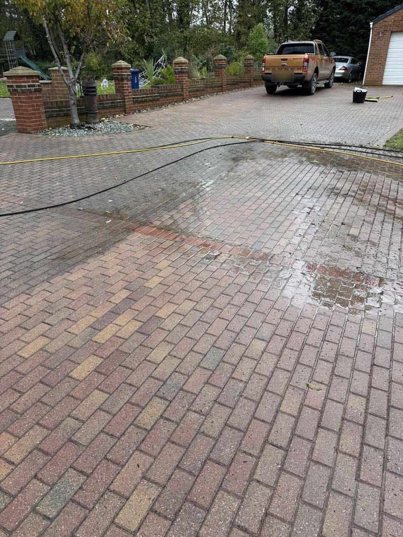 Block paving driveway being pressure washed in Normanby