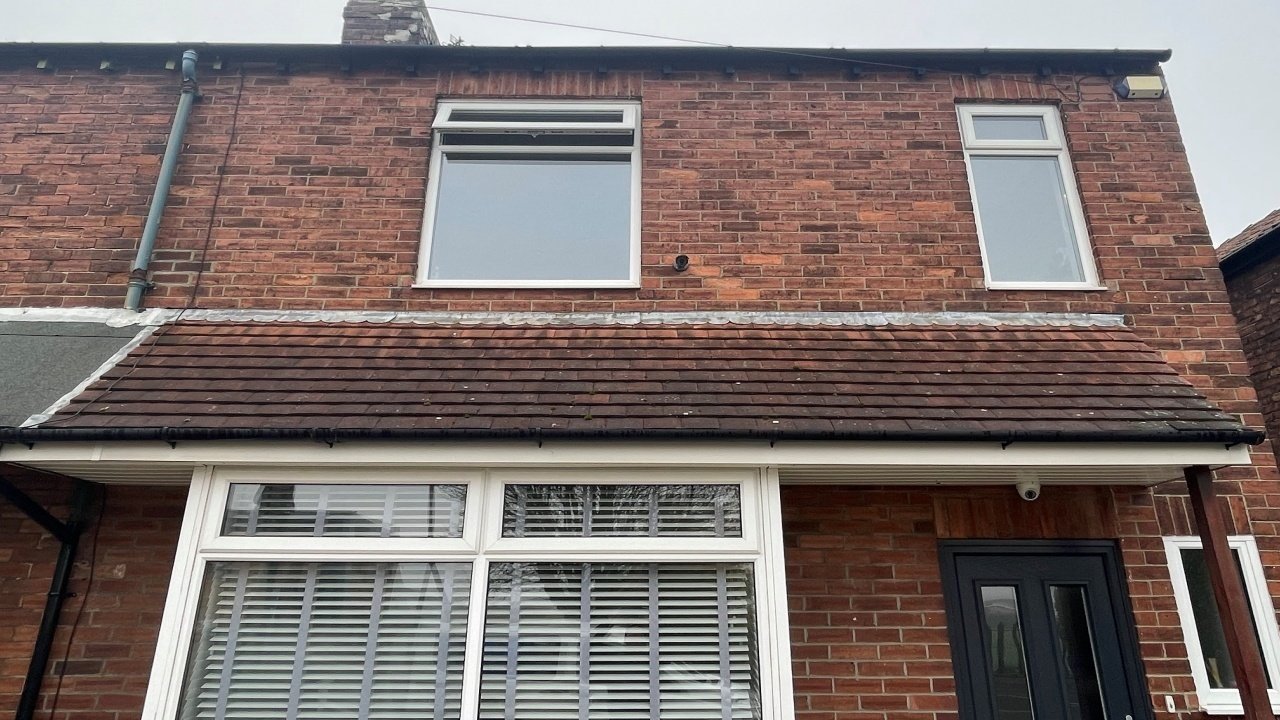 House roof with moss before roof cleaning and biocide treatment in Teesside